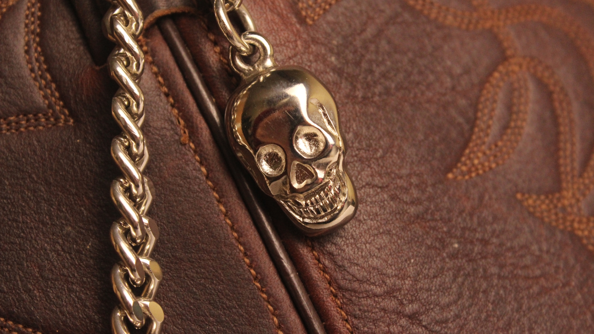 Custom skull-shaped badge combined with a metal chain