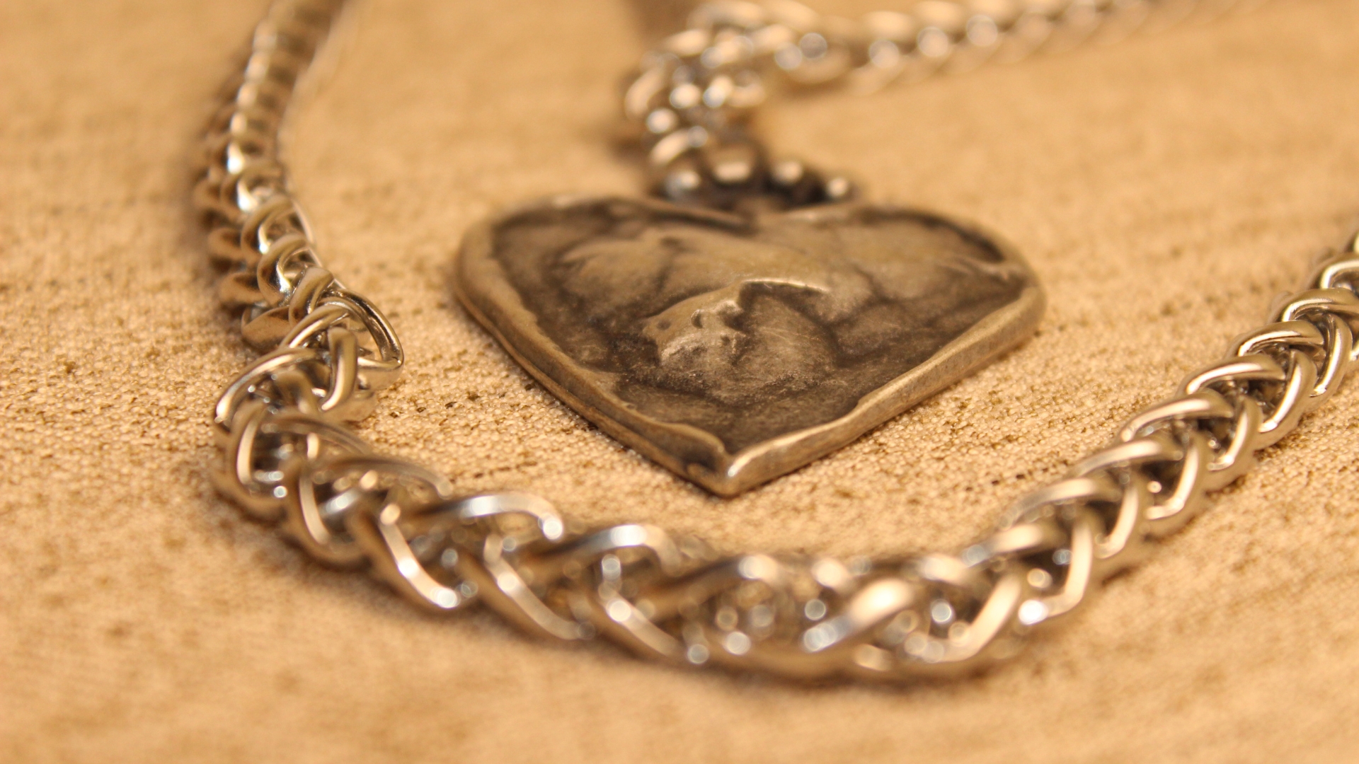 Custom heart-shaped badge inserted into a metal chain